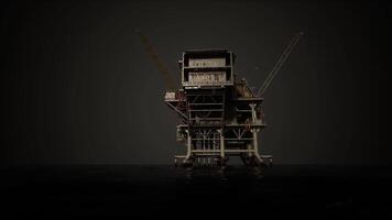 oil rig with a crane reaching towards the sky in the middle of the ocean video