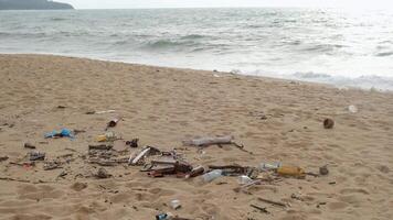 Garbage on the sandy beach of the ocean. The concept of environmental protection, ecology and cleanliness of coastlines video
