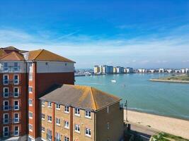 High Angle View of Historical Central Eastbourne Buildings and City of England, United Kingdom. Aerial Footage Was Captured with Drone's Camera During Windy Day on May 11th, 2024 photo