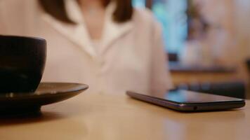 Female gesturing while talking in a cafe. video