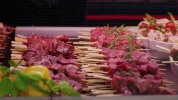 Selling chops of beef meat on skewers layout in the store. video