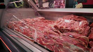 Large amount of lamb meat on display in a butcher shop. video