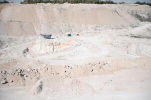 sand quarry, in the photo, a quarry for the extraction of sand against a blue sky photo