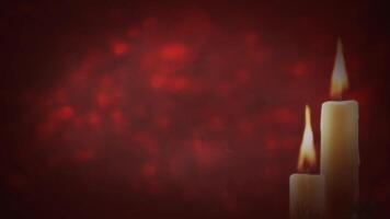 Christmas Candles in Smoky Red Atmosphere 4K Loop features two candles burning in a dark red atmosphere with smoke rising in the background in a loop video