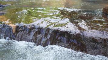 Tranquil Landscape Flowing Water Over Smooth Rocks in Natures Peaceful Stream, Capturing Beauty of Outdoor Serenity and Calming Atmosphere for Relaxation. video
