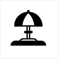 A black and white icon of a lamp on a table vector