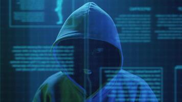 cybercriminal hacker in a mask close-up rejoices video