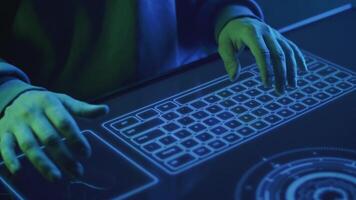 close-up of a hacker's hands typing text on a touch keyboard video