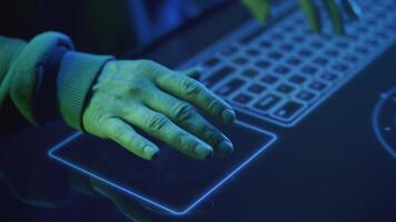 close-up of a hacker's hands runs his fingers over the touchpad video