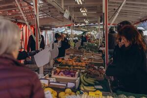 Stuttgart,GERMANY,March 9,2024,People attending farmers market,exploring fresh produce photo