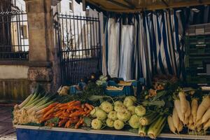 A market stall filled with fresh fruits on display, offering a colorful selection of produce. photo