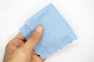 top view of hand with cleaning cloth isolated on white background photo