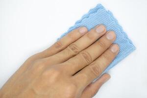 top view of hand with cleaning cloth isolated on white background photo