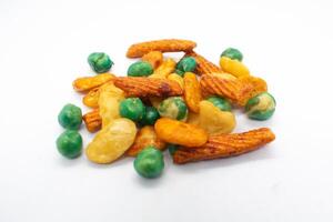 A pile of assorted mixed nuts, healthy snacks, salty snacks and snacks, on a white background photo