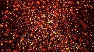 Abstract animation concept of golden particles for celebrating birthdays and holidays. 4k loop bokeh background with light particles on a dark background. Animation footage video