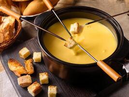 Fondue with bread sticks photo