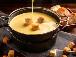Fondue with cheese and bread photo