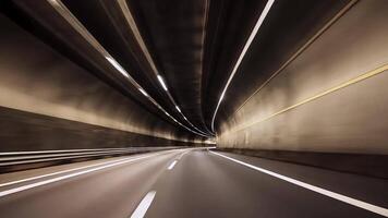 Dynamic perspective of a car speeding through a curved tunnel, with light streaks and motion blur highlighting urban transportation, modern road systems, and the excitement of night driving. video