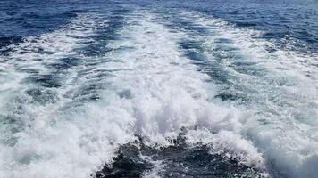 The churning water behind a boat in the Mediterranean caused by the powerful boat engine at full speed. video