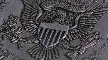 E pluribus unum design half dollar coin metal texture turn table video