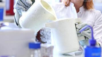 Laboratory technician doing lab research with a liquid nitrogen, lab experiment, chemistry concept video