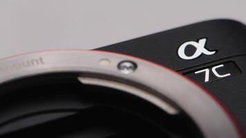 Japan, Tokyo - May 20, 2023. Close-up camera and lens. Action. Details of new camera model on isolated background. New camera with improved shooting qualities video