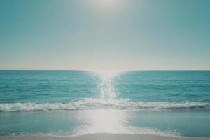 Tranquil ocean view with sparkling water and gentle waves under a bright sky at midday photo