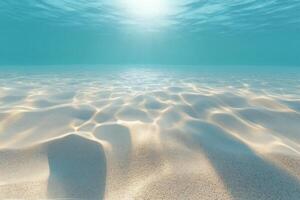 Sunlight glimmers on the sandy ocean floor in a peaceful underwater setting photo