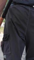 vertical close-up view from behind, bare-chested man carries sledgehammer video