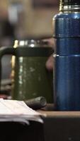 vertical close-up builder, mechanic looking at blueprints, work plan video