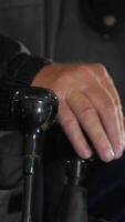 vertical close-up of the tractor driver controls the tractor with levers video