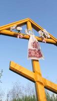 vertical A large wooden Orthodox Christian cross stands in a field video