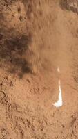 vertical handheld console game covered in a layer of dust and soil video