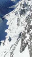 Experience the stunning and breathtaking aerial view of majestic snowcapped mountains and glaciers video