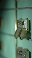 A closeup image showcasing a lock with a hand reaching out to grab hold of it closely video