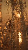 Golden Sunset Reflected Beautifully in Water Drops That Create a Stunning Visual Display video