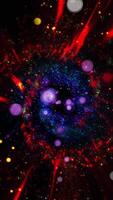 A mesmerizing explosion of neon multi-colored shimmering particles forming spirals of cosmic energy. video