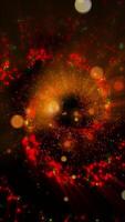 A mesmerizing explosion of neon multi-colored shimmering particles forming spirals of cosmic energy. video