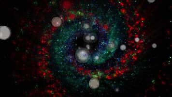 A mesmerizing explosion of neon multi-colored shimmering particles forming spirals of cosmic energy. video