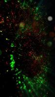 A mesmerizing explosion of neon multi-colored shimmering particles forming spirals of cosmic energy. video