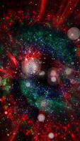 A mesmerizing explosion of neon multi-colored shimmering particles forming spirals of cosmic energy. video