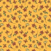 A pattern of small flowers and leaves. Seamless fabric background with a bohemian pattern in the form of small flowers. vector