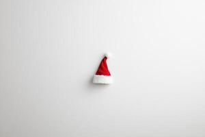 Red Santa Hat with White Fur Trim on a White Background photo