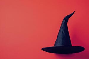Black Witch Hat on a Red Background photo