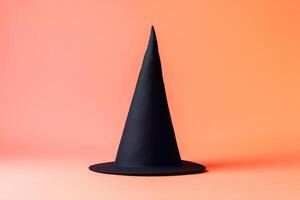 Black Witch Hat on Peach Background photo