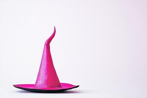 A Pink Witch's Hat Against a White Background photo