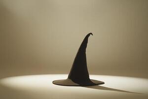 A Black Witch Hat Standing Tall on a White Surface photo