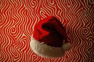 Red Santa Hat with White Fur Trim on Red and White Swirly Background photo