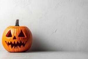 A Carved Jack-o'-Lantern on a White Textured Background photo