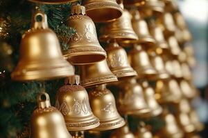 Golden Bells Adorned with Glitter on a Christmas Tree photo